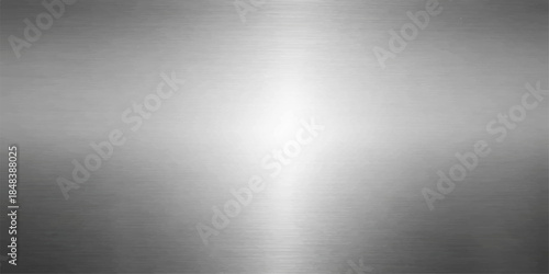 A shiny silver brushed metal plate background features a textured stainless steel pattern with light reflections on a gray metallic aluminum surface