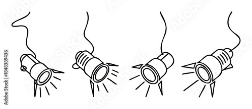 Set of four line drawings of hanging spotlights with emanating light beams, perfect for presentations and interior lighting concepts.