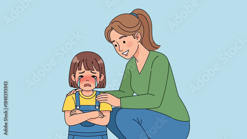 Caring mother comforts her crying child with a reassuring touch and gentle smile
