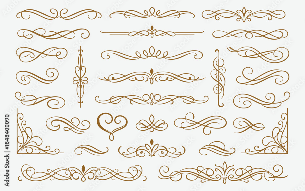 Fototapeta premium Elegant gold swirling ornamental design elements set