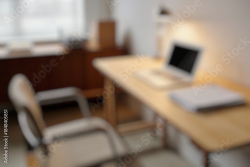Wallpaper Mural Blurred image of a minimalist home office with white desk, laptop, and potted succulent, creating a serene workspace. Blurred image, ideal for design concepts. Torontodigital.ca