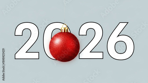 Red christmas ball nestled in large white outlined numbers 2026 on light blue background for new year's eve celebration