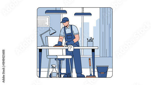 Man wearing overalls working at desk.
