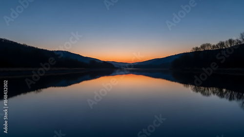 Wallpaper Mural Sunrise and sunset over a calm lake with mountains and sky reflections Torontodigital.ca