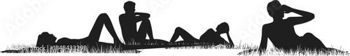 Silhouettes of people lying on grass in relaxed poses showing leisure, peace, and outdoor rest in nature