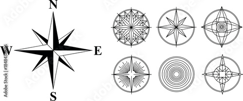 One large classic wind rose compass with "N, S, E, W" and six circular geometric navigation symbols
