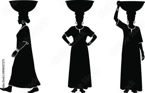 Set of three African women silhouettes carrying baskets on their heads in traditional clothing, showcasing various poses, vector illustration.