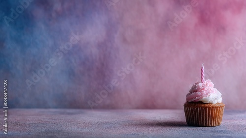 Birthday cupcake in party hat with candle, pastel pink-blue gradient, minimalist center copy space—perfect for birthday card or cake e-commerce hero
