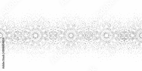 Intricate grayscale pattern of circular and floral elements repeating horizontally