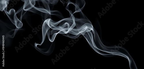 Wispy tendrils of grey smoke curl and dissipate against a stark black background, still, smoke