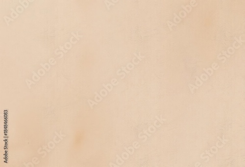 A textured beige concrete wall, showing subtle variations in tone, vintage, earth tone
