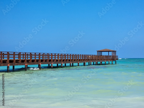 A pier stretching far out to sea.