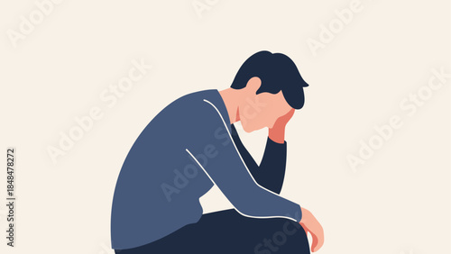 Person deep in thought sitting alone wearing blue outfit in simple style