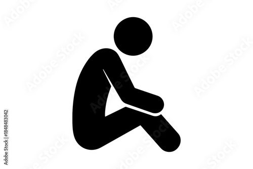 Silhouette of a person sitting with elbow on knee in deep thought