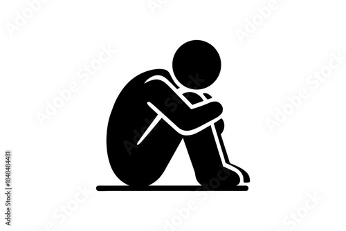 Monochrome silhouette of a person sitting alone in thought