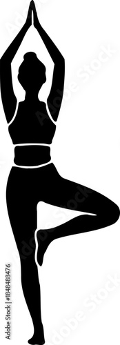A woman in a yoga pose silhouette standing on one leg with arms raised
