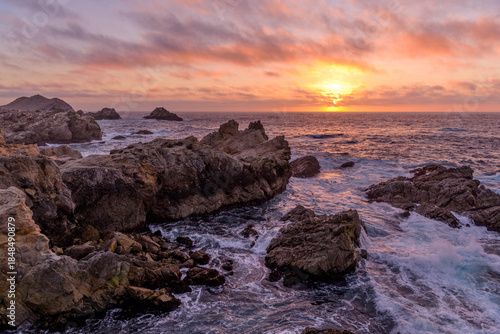 Sunset Cove - A colorful sunset view of a rocky cove at Point Lobos State Natural Reserve. Monterey, Central Coast, California, USA.