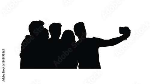 Silhouette of a group of four friends taking a selfie together with a smartphone camera