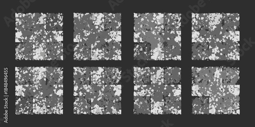 Abstract grid of textured grayscale squares resembling broken or distressed surfaces