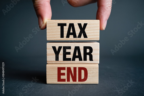 Tax year end financial deadline tax season ending with wooden blocks and business deadline