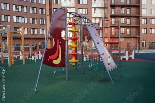 Modern playground for children in courtyard. Exercise equipment