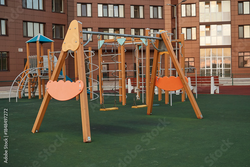 Modern playground for children in courtyard. Exercise equipment