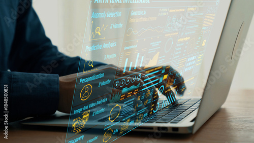 Φωτογραφία A focused user interacts with a sophisticated data analytics interface on a laptop, showcasing artificial intelligence trends and business insights crucial for decision-making