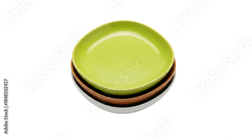 Stack of colorful ceramic dishes with a bright green bowl on top presented cleanly