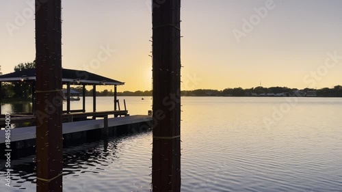 Lake Roy sun setting boat dock from wooden deck