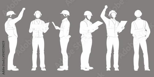 Group of construction workers in silhouette reviewing plans and communicating