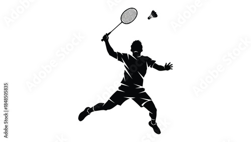 Silhouette of a badminton player in action preparing to strike the shuttlecock