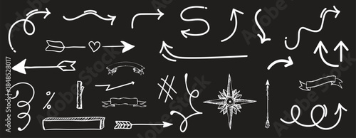 Collection of hand drawn white arrows on black background