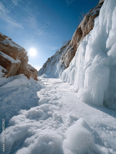 Wallpaper Mural Snowy, icy pathway between cliffs under a clear blue sky. Torontodigital.ca