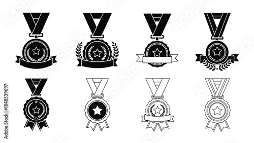 A collection of black and white award medals and ribbons in various designs