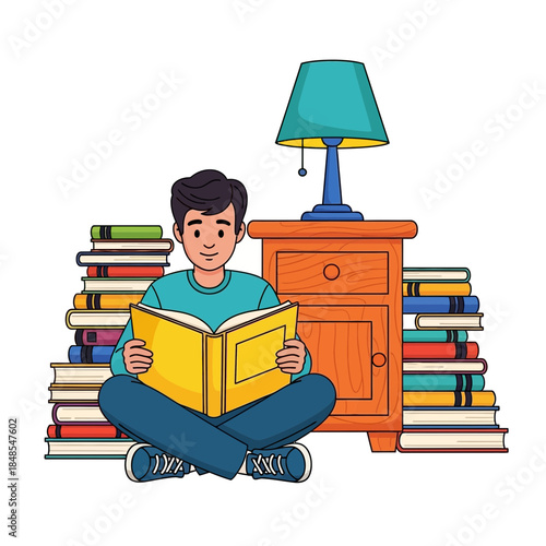 Young man sitting crosslegged on the floor reading a yellow book next to a stack of books and a nightstand with a lamp