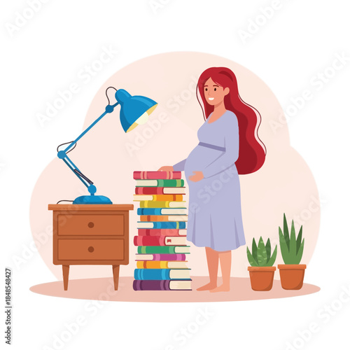 Pregnant woman with long red hair standing next to a stack of colorful books and a desk lamp on a nightstand
