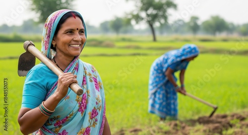 Happy Indian Woman Farmer Smiles in Green Agricultural Field