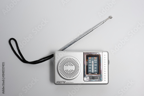 Portable battery-powered AM/FM radio photographed against a white background.