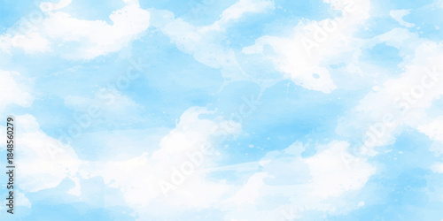 A beautiful clear blue sky features bright white fluffy cumulus clouds on a sunny summer day creating a high atmosphere cloudscape in the light of heaven
