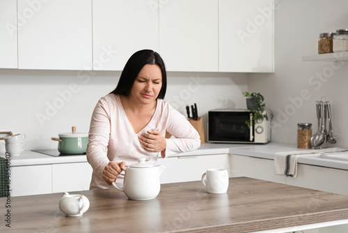 Young woman with teapot hav...