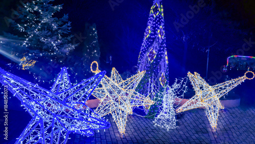 Bright neon signs and garlands Ice skating rink and winter entertainment concept
