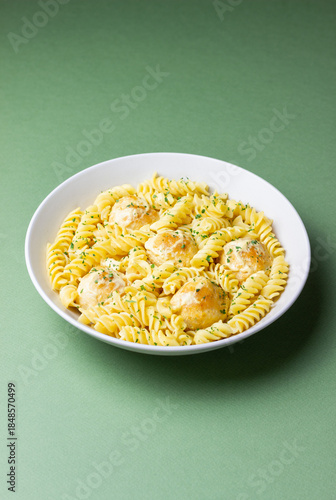 Pasta with chicken meatballs in a creamy sauce. Italian cuisine. Recipe.