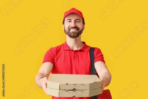 Male courier with pizza box...