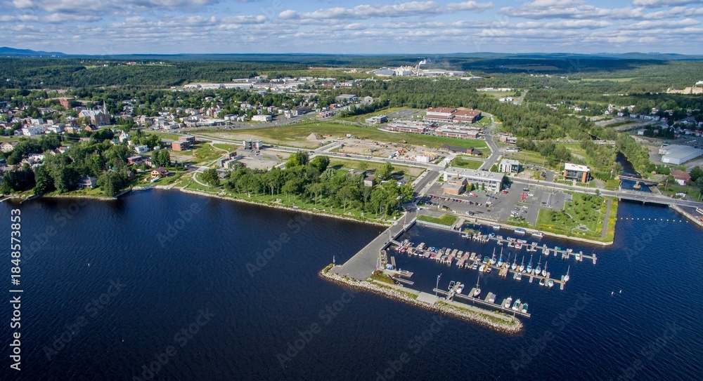 Obraz premium Aerial View of a Lac-Megantic, Quebec, Canada, With Boats Docked on the harbor on a Sunny Day