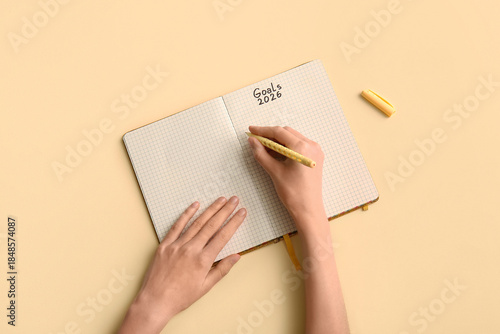 Woman writing goals on 2026...