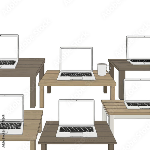 Group of laptops on wooden desks in office setup.