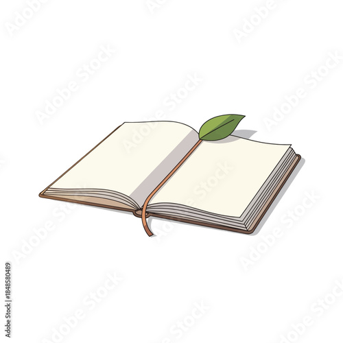 Open notebook with a single green leaf resting on pages.