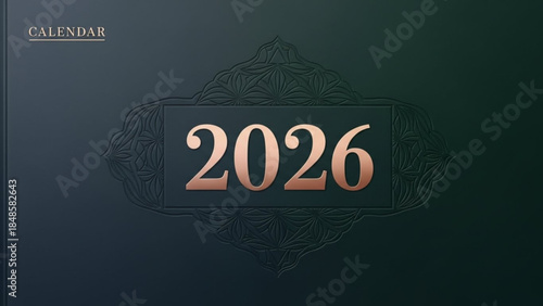Dark blue 2026 calendar cover with gold text and ornate design elements on a gradient background