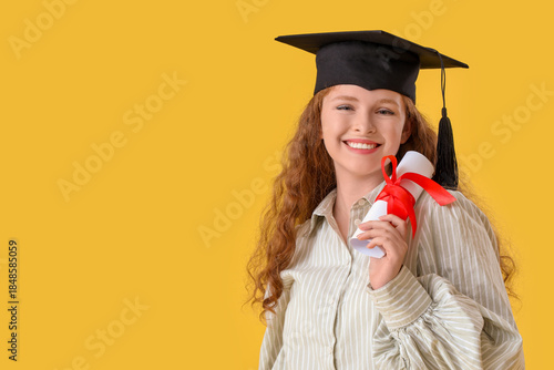 Happy female student in gra...