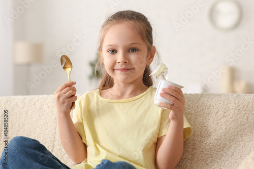 Cute little girl with spoon...